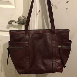 Fossil burgandy purse great condition no tears or rips or stains (: